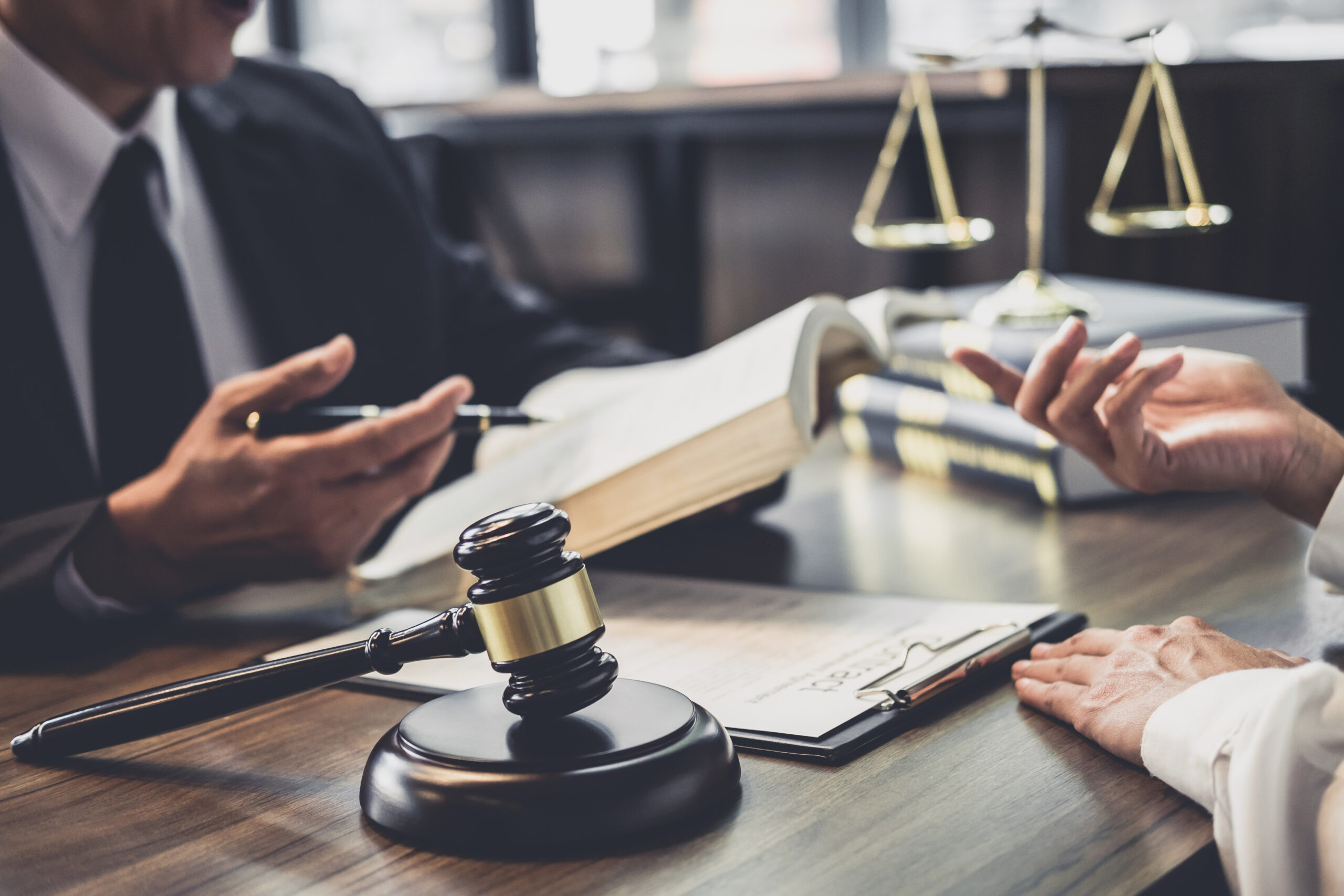 Merchant cash advance defense attorney consulting with a client in Dallas, Texas